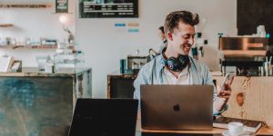 Man checks his email while working