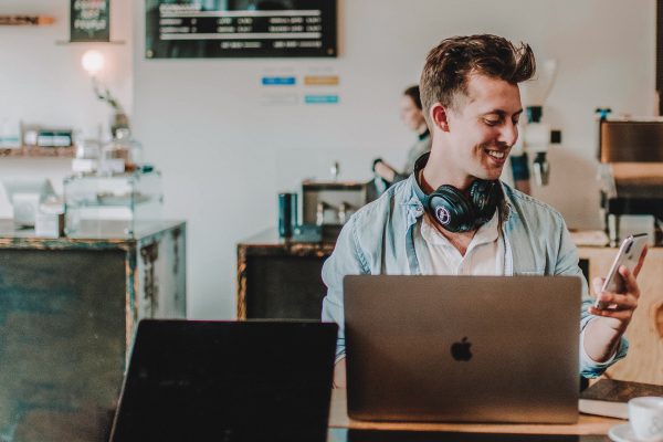 Man checks his email while working